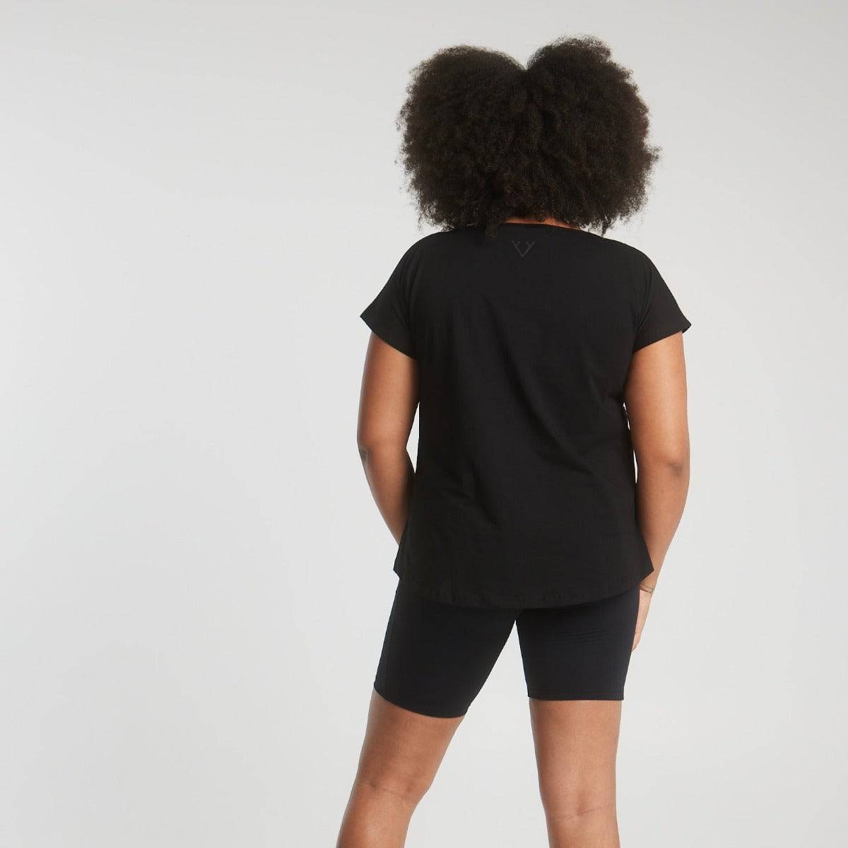 Woman wearing Victoria Stag's Core Cap Sleeved Tee in Black V2 back